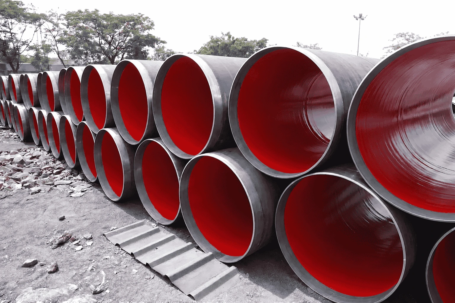 Liquid epoxy lined HSAW pipes showing green internal coating